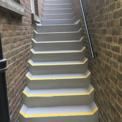 Resin coated staircase with safety pathway repairs & safety grip nosings