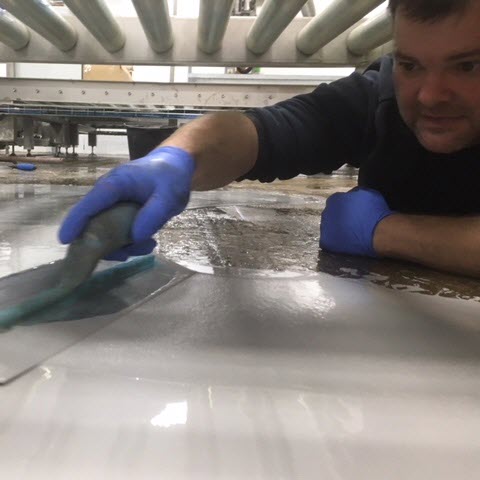 Wayne Thomson hand trowelling resin floor