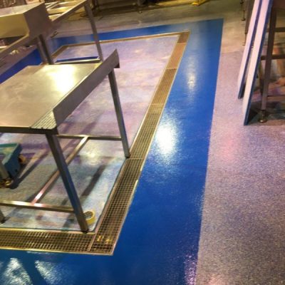 Fishmongers Quartz resin floor repair with Chelsea blue band to hide drain